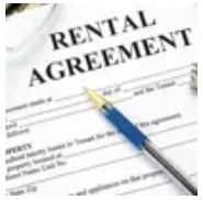 A rental agreement with a pen and glasses.